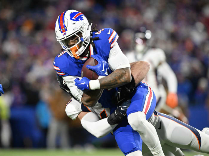 Buffalo Bills running back James Cook gets tackled against the Denver Broncos.
